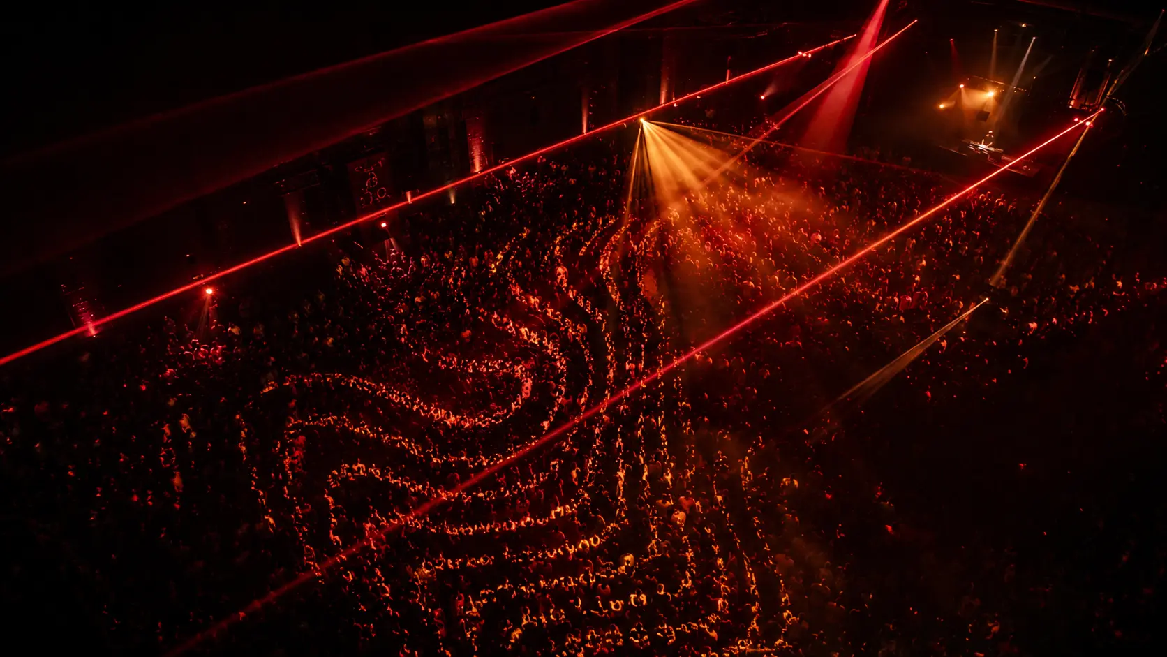 Electronic music crowd and laser waves